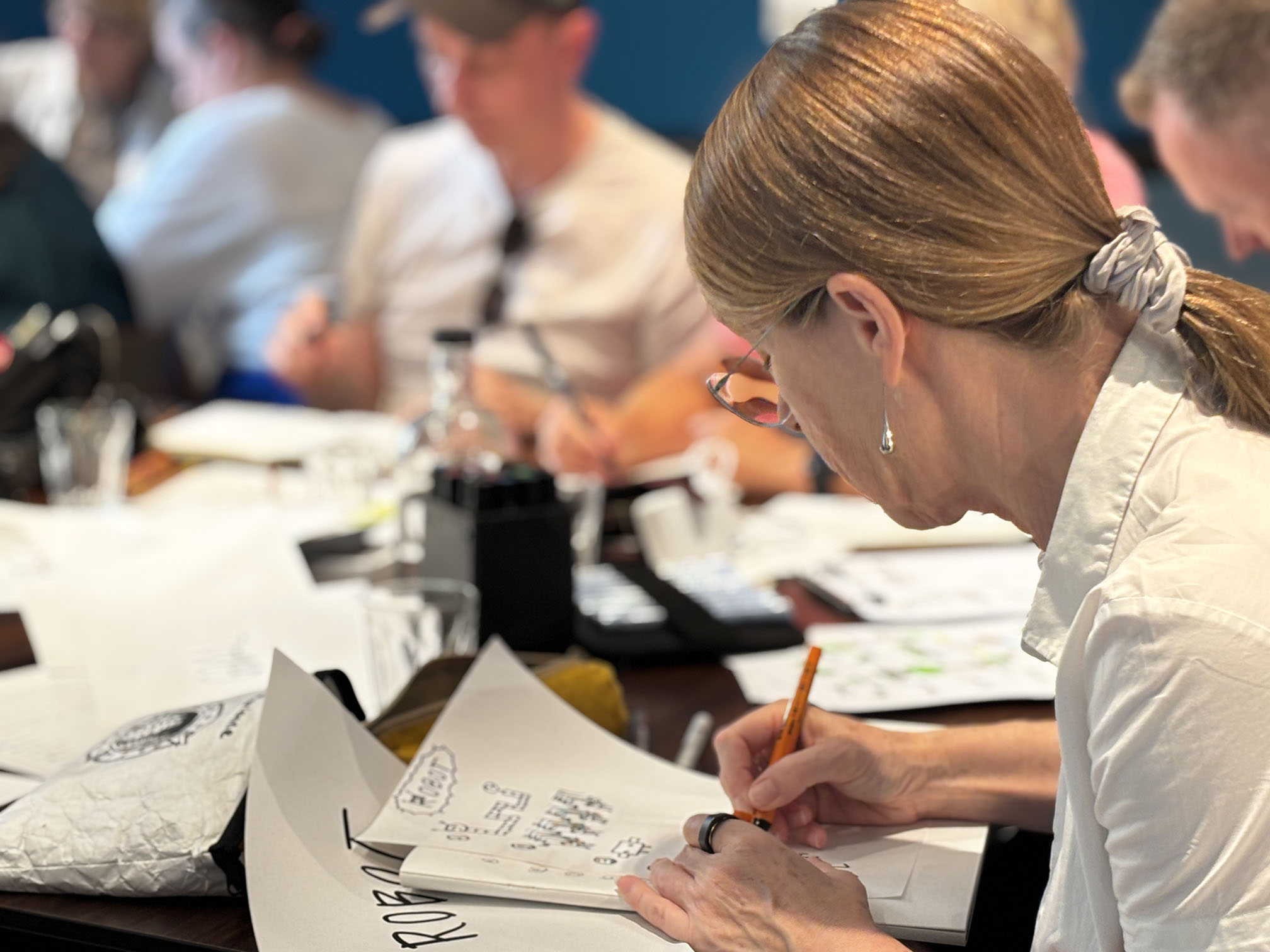 A photo of one of the attendees drawing